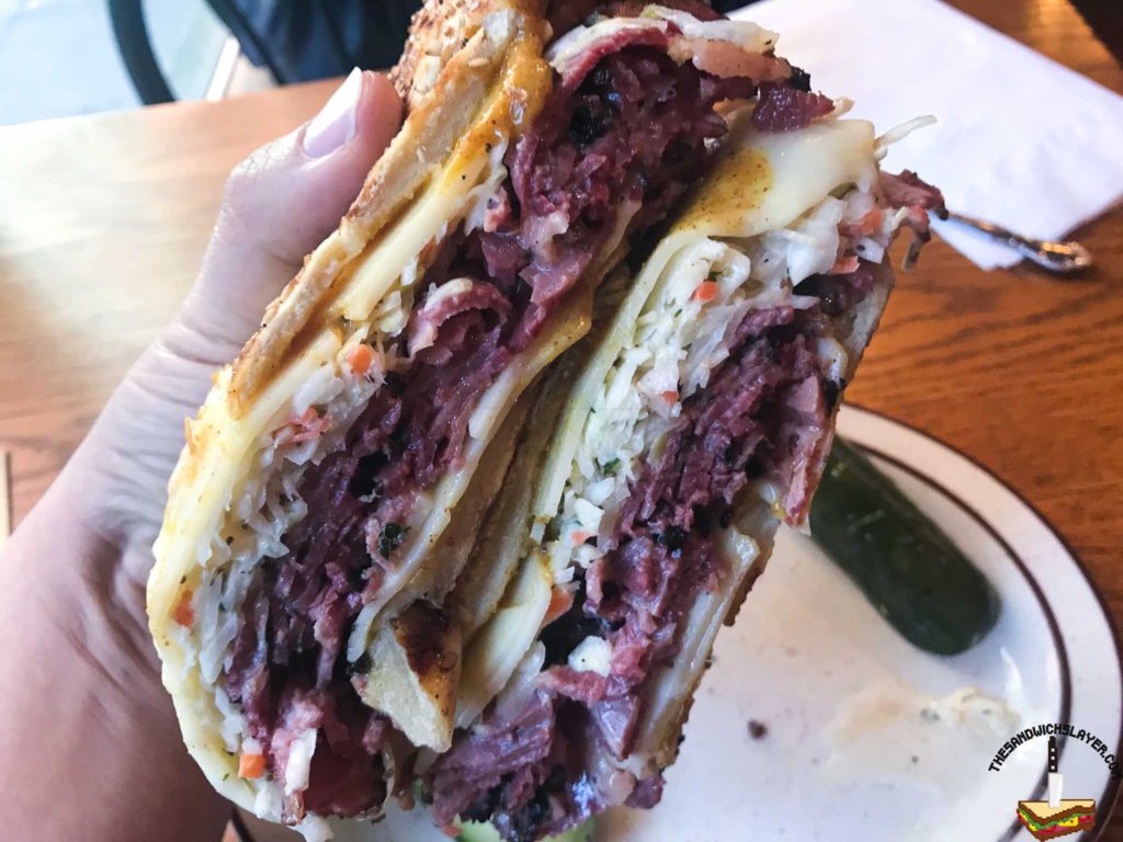Rumanian Pastrami, Honey Chipotle mustard, slaw, and swiss cheese on a grilled sesame Italian roll