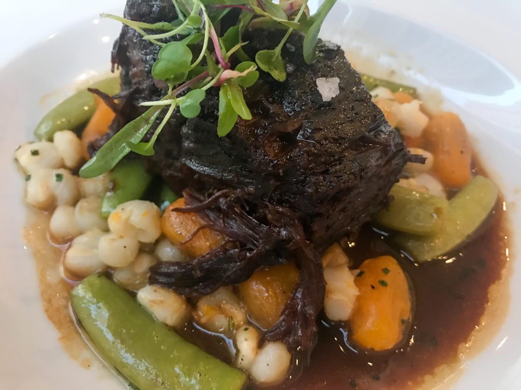Braised Short Rib with hominy, sungold tomato, and snap peas