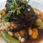Braised Short Rib with hominy, sungold tomato, and snap peas